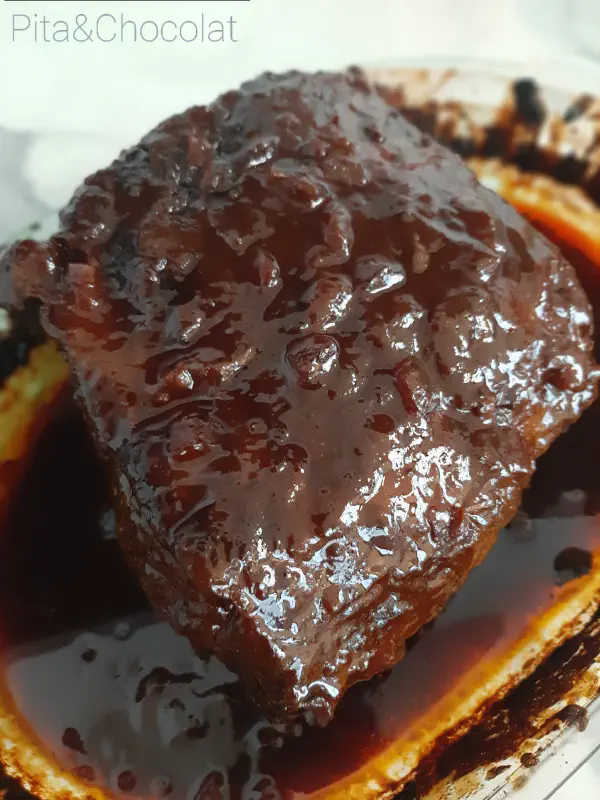 Pulled beef in baking dish after cooking